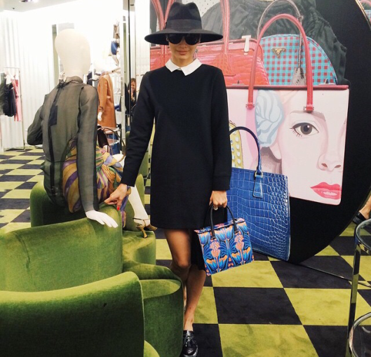 Cindiddy in white collared black dress at Prada.  www.cindiddy.com